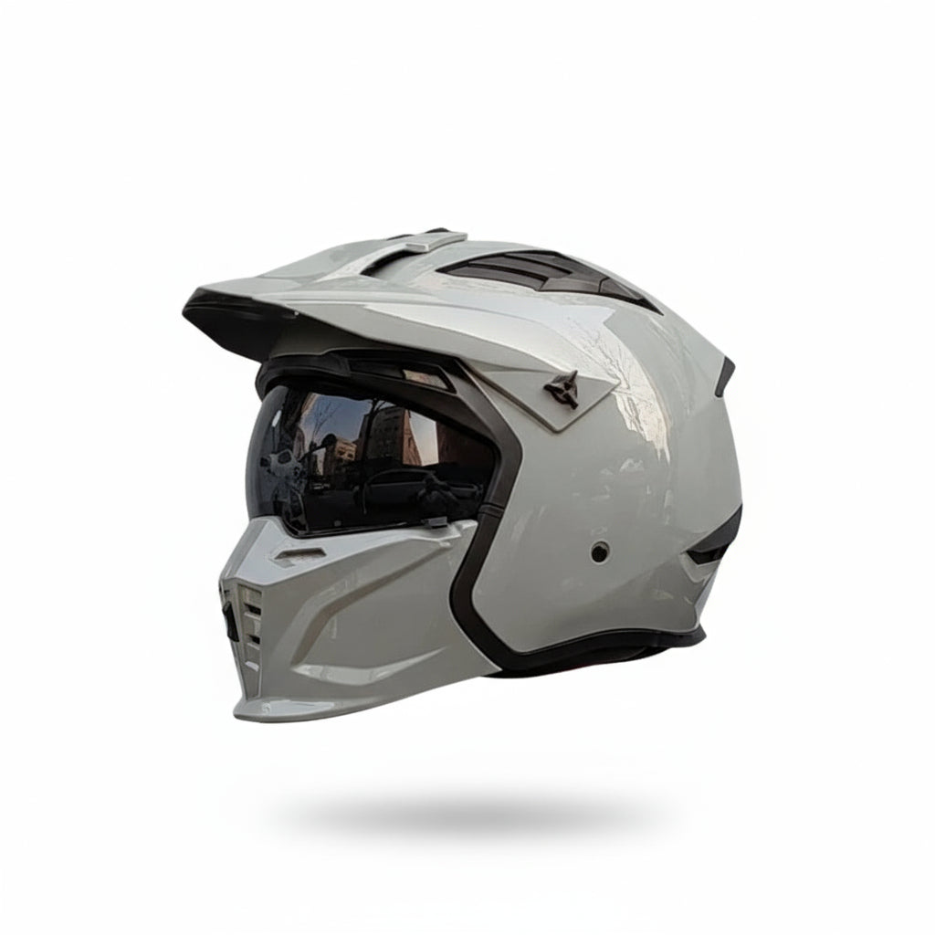 Matte skull helmet with mirrored visor and metallic grey accents.